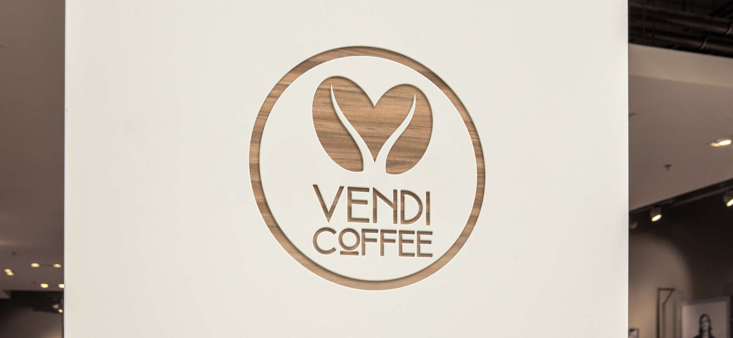 Vendi coffee logo on a wood accent wall