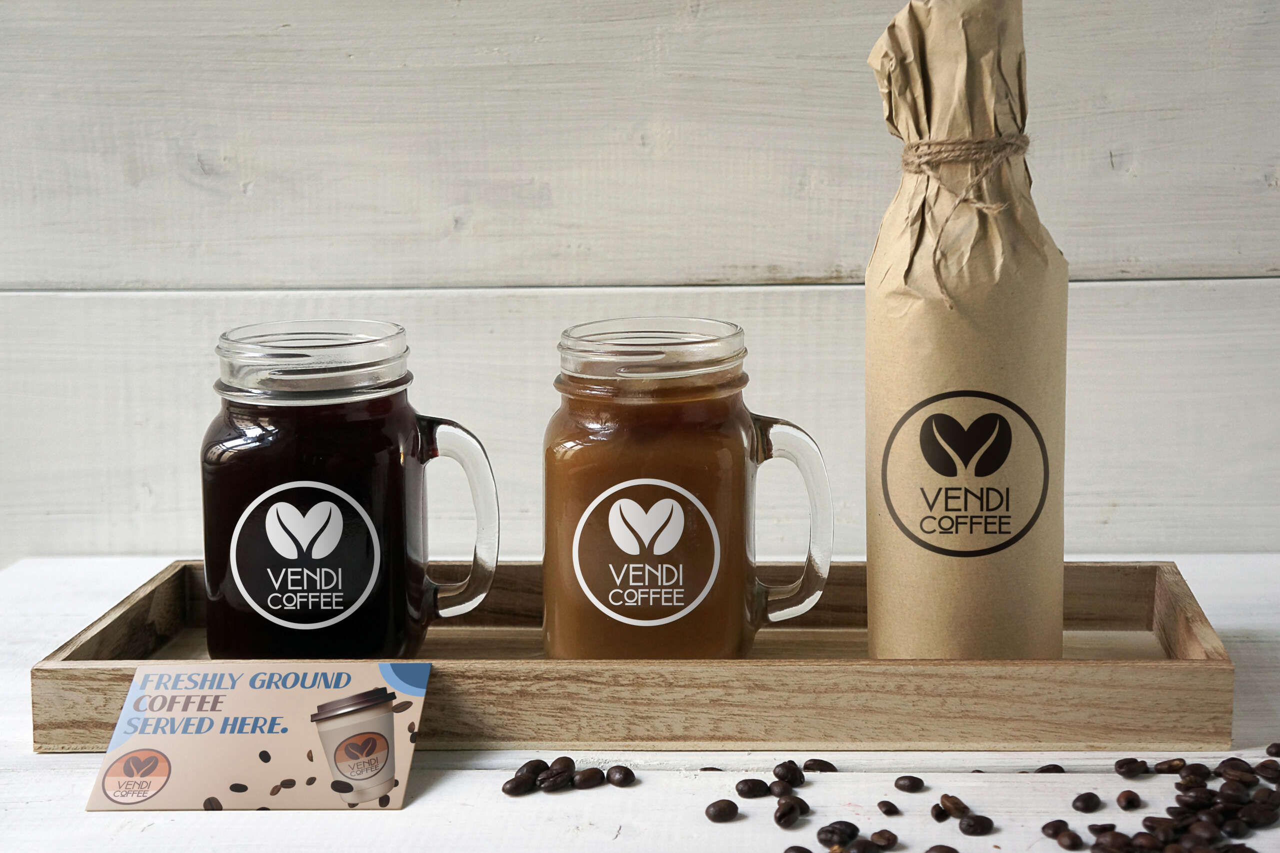 Vendi coffee logo on glass coffee mugs on a tray next to a vendi coffee card