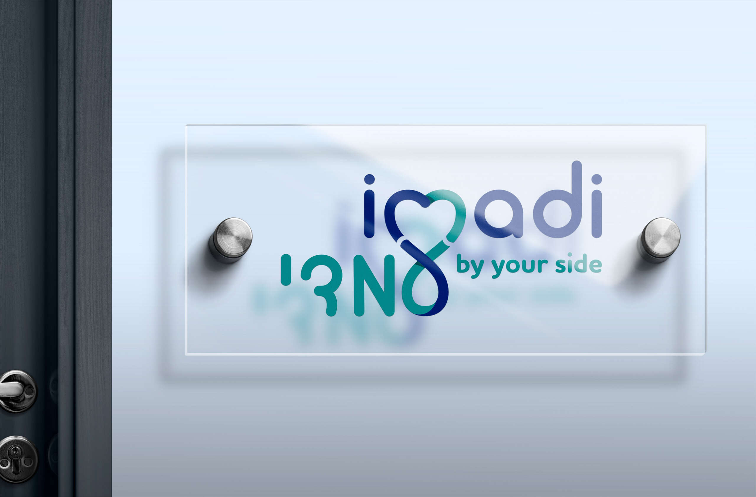 imadi logo on acrylic office sign